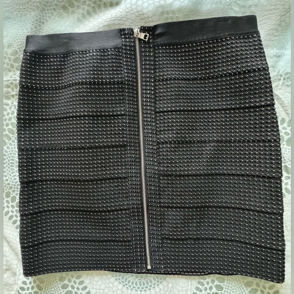 Never worn Knee length black skirt with sparkly threading
